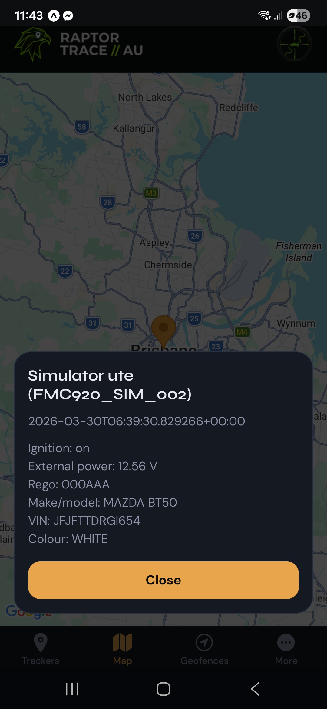 Bottom sheet on the map with tracker name, timestamp, ignition, voltage, rego, make, VIN, and colour.